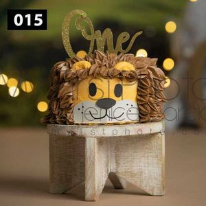 Rustic wooden cake stand decorated with ornate details and golden bokeh lights in background.