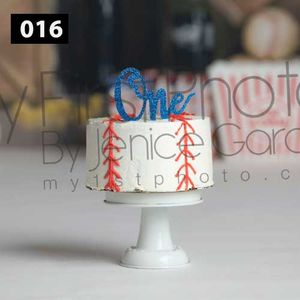 White cake stand with red stick figure decorations against a blurred background.
