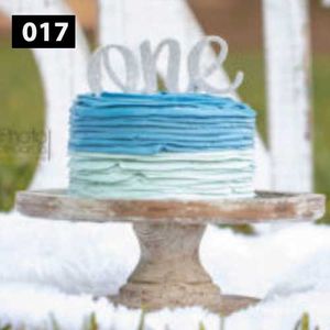 Cake stand with blue ombre frosting detail on display.