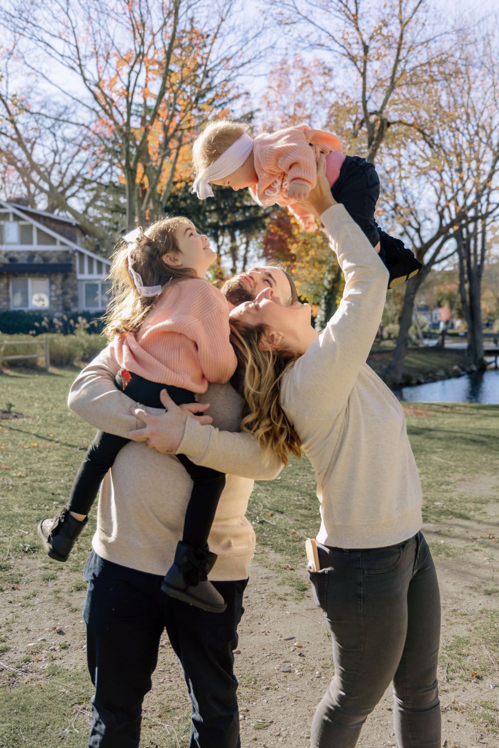 A playful series of photos showing a couple dancing and dipping in a park during autumn.