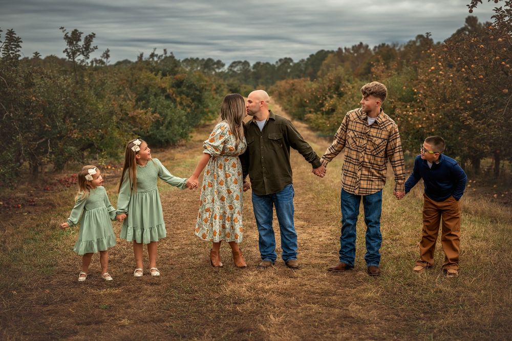 A sequence of family photos showing people walking hand in hand through a rustic outdoor setting at sunset.