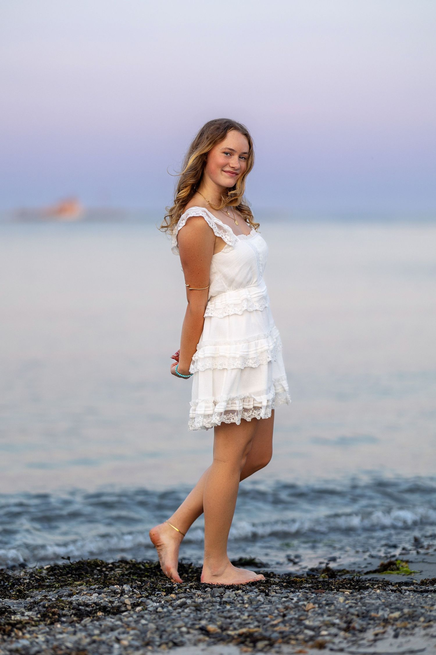 Senior portrait at sunset by the water New Castle, New Hampshire