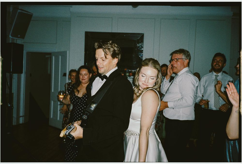 A series of candid black and white party photos showing people dancing and socializing at a formal event.