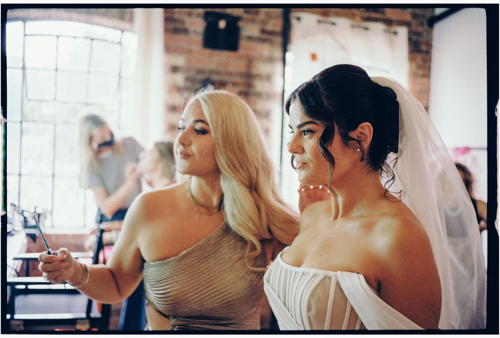 A collage of wedding preparation moments showing details of hair styling and makeup application in a bridal suite.