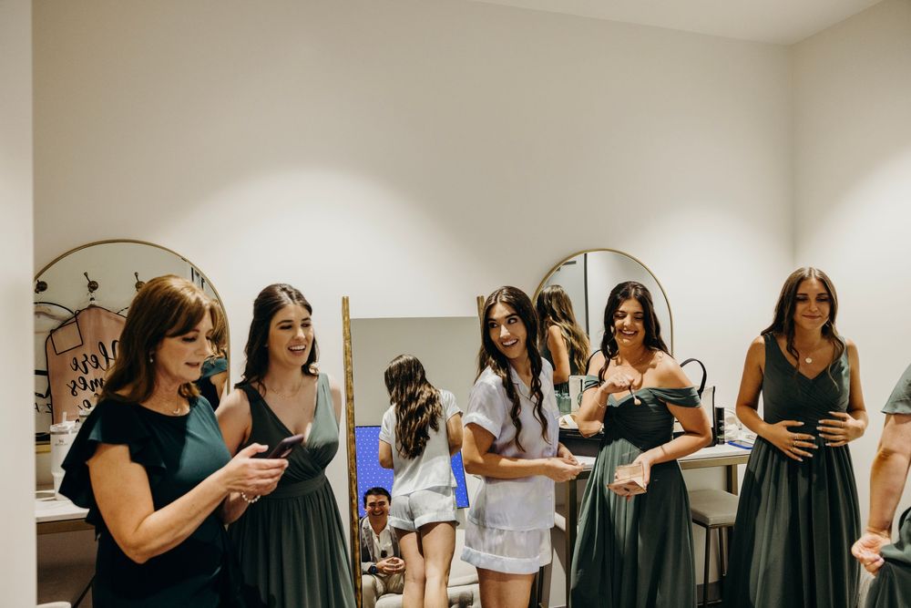 A series of candid moments captured at an indoor gathering showing people interacting and embracing in a casual setting.