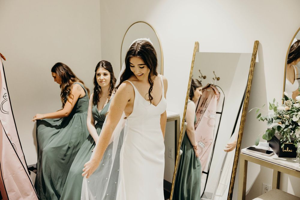 A series of bridal preparation photos showing wedding dress fittings and getting ready moments in a light-filled room.