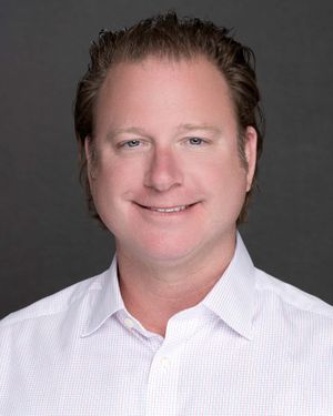 Executive headshot of Charleston SC company leader with confident expression