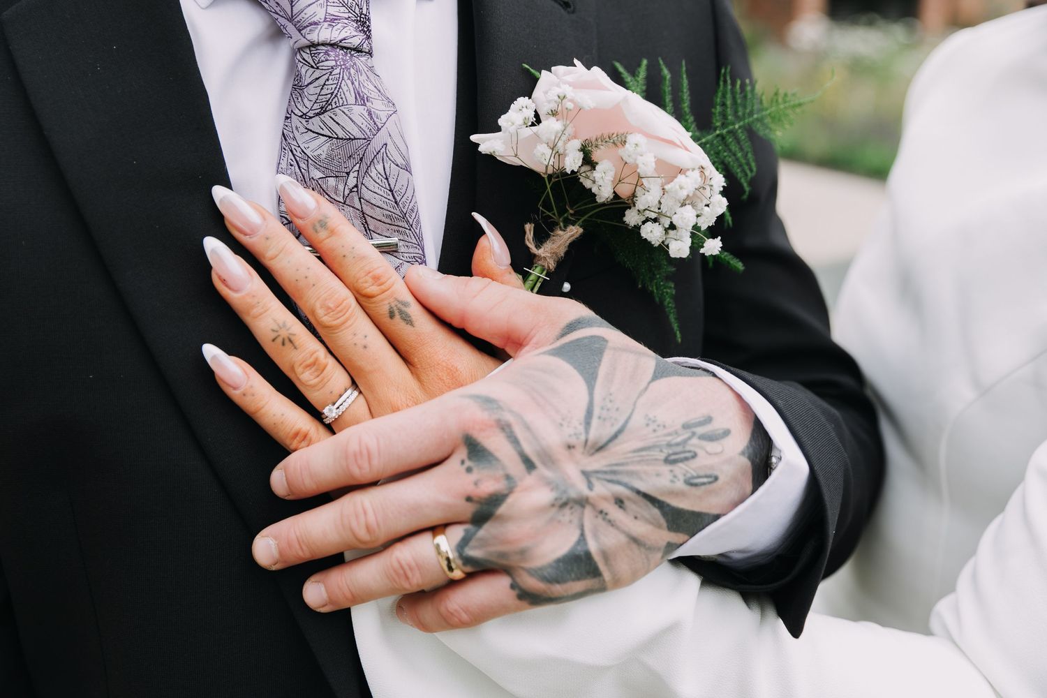 Close-up shots of hands with tattoos and wedding rings during ceremony moments.  Photographer. Hull. East Yorkshire. Photography