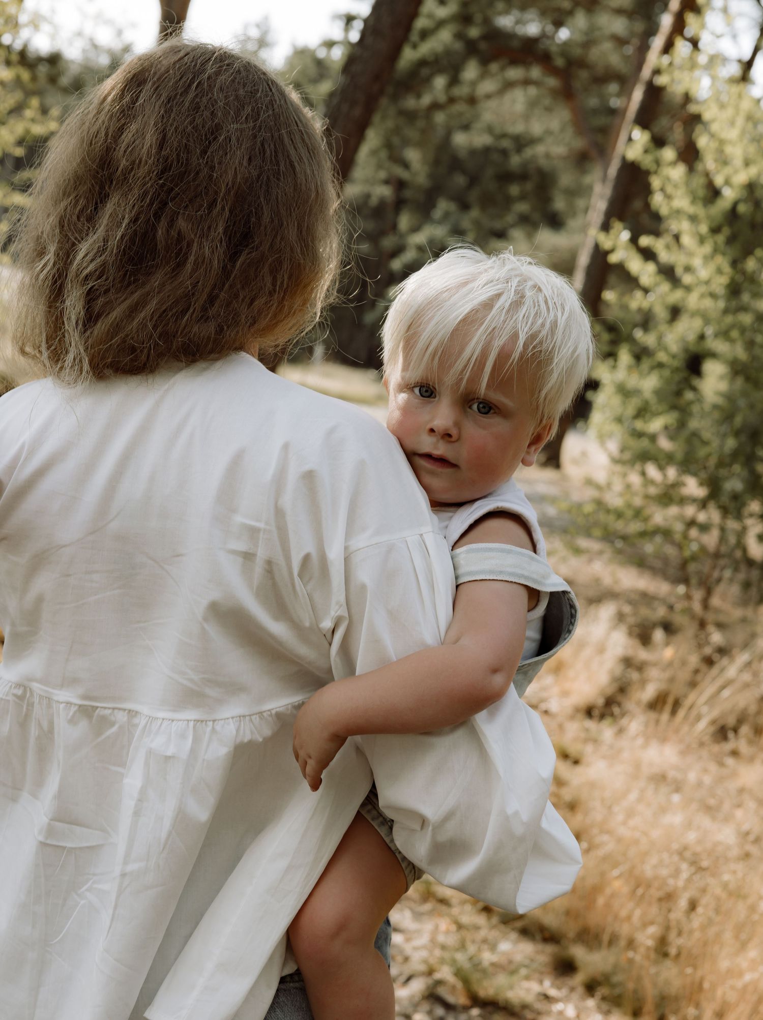 Series of candid moments showing people in white shirts embracing outdoors.