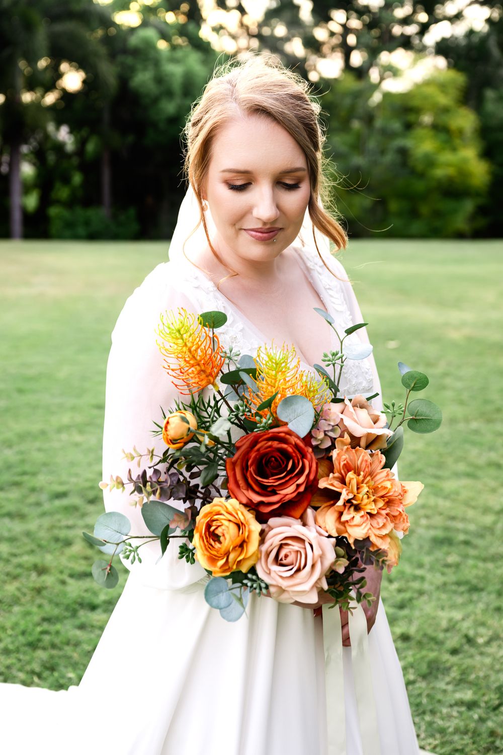 A series of floral bouquets with orange, red and pink roses against a green outdoor background.