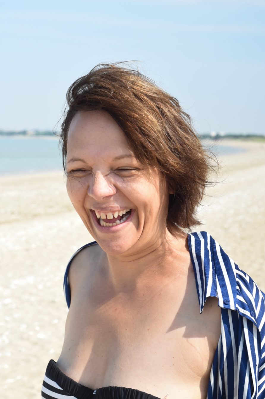 A series of candid beach photos showing someone in a blue and white striped top enjoying a sunny day by the ocean.