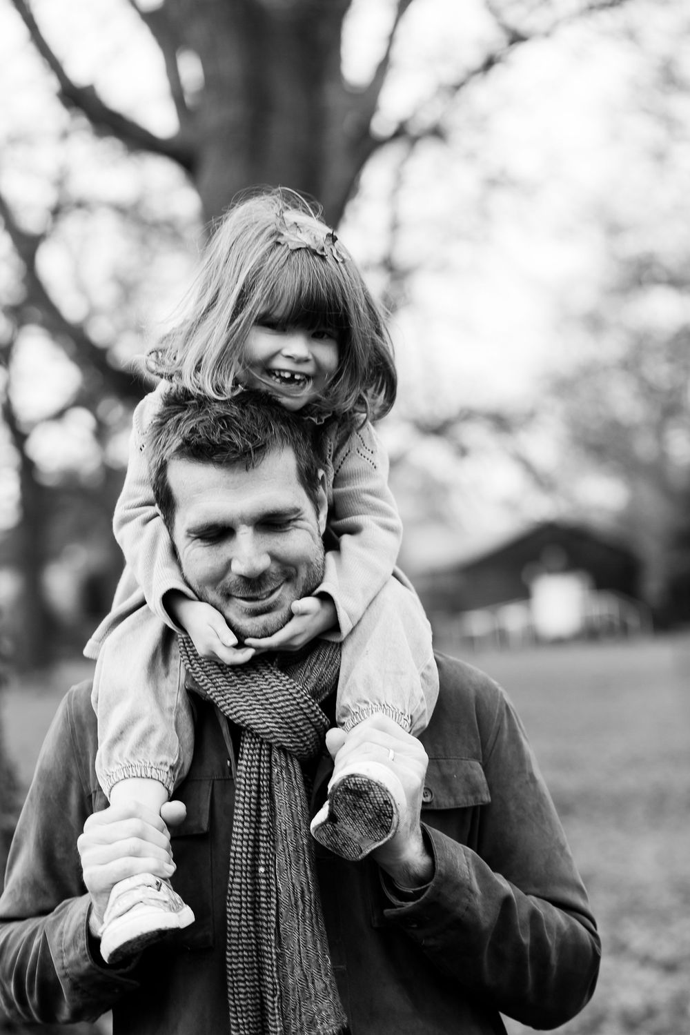 Black and white photo sequence showing a playful expression sequence with hands covering and revealing face.