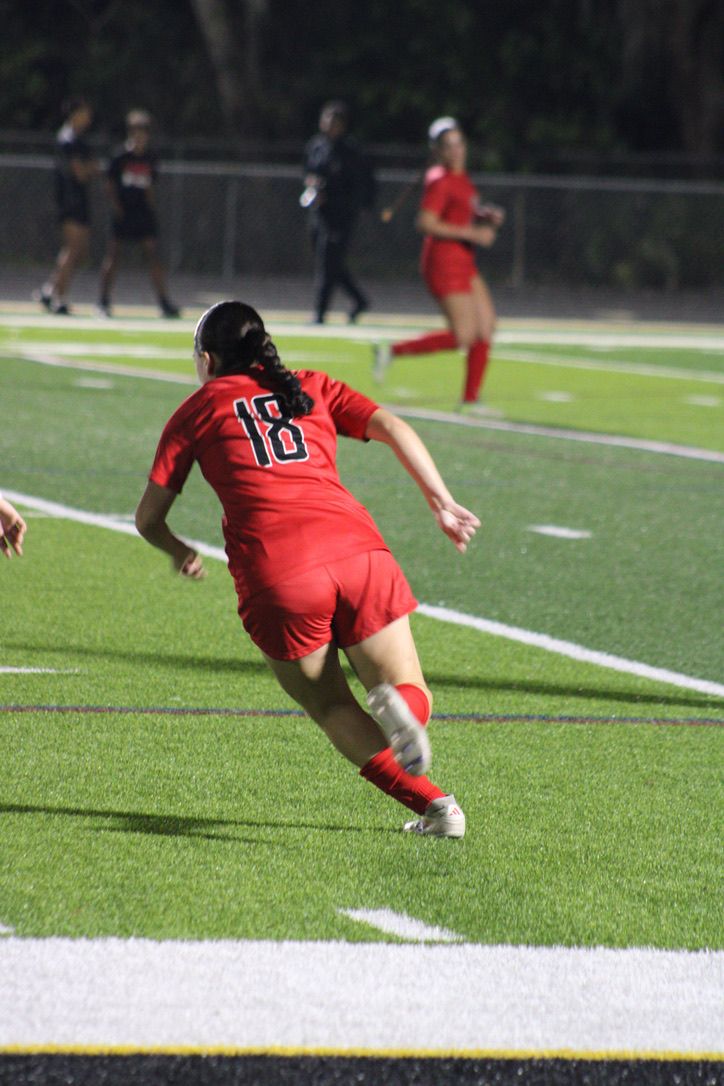 A sequence of action shots shows a rugby player in red jersey diving to score a try on a grass field.