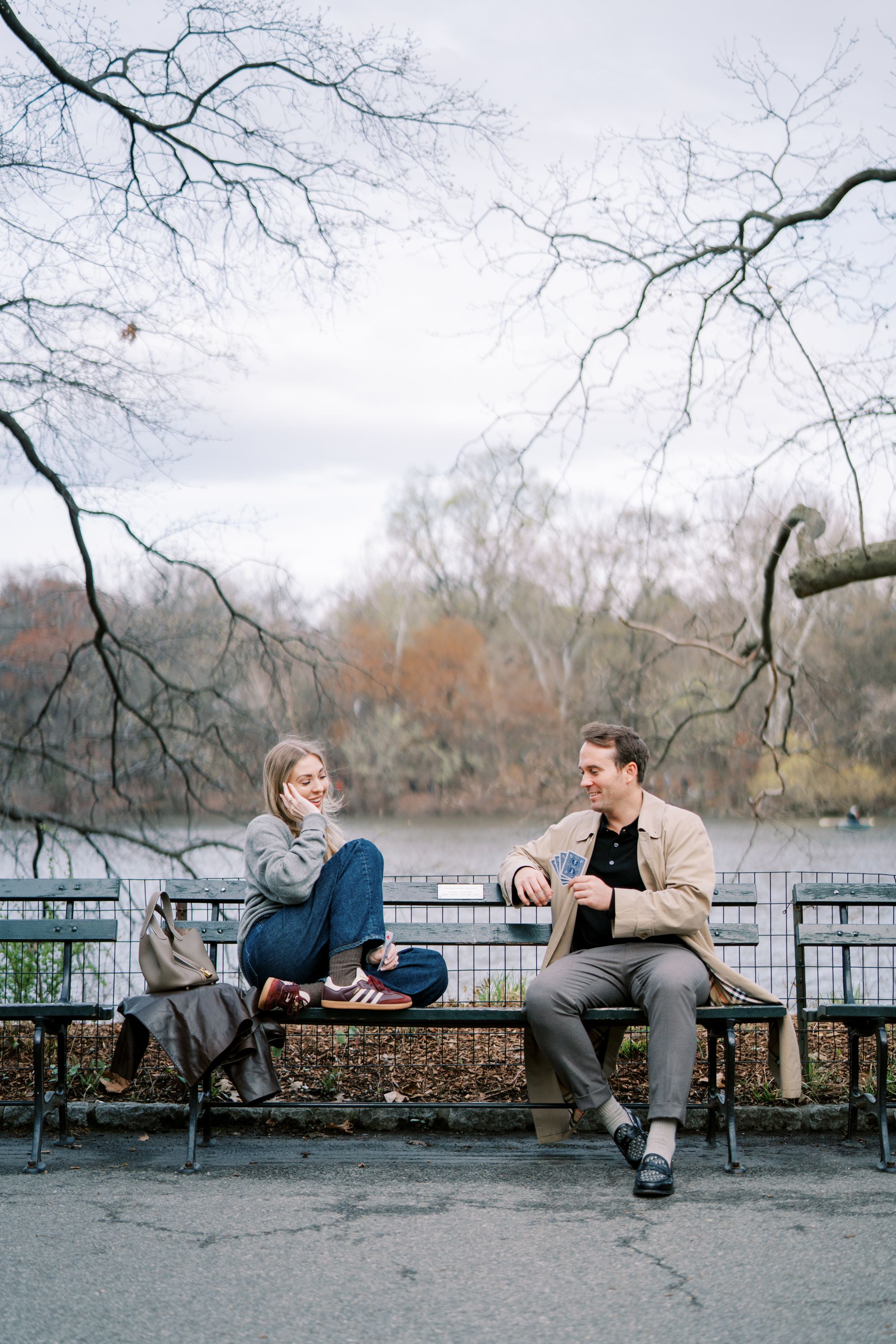 Two people relax on a bench overlooking a lake on a winter day through a series of connected photos.