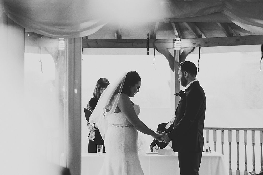 A series of black and white wedding photos showing couples dancing and celebrating at an elegant reception venue.