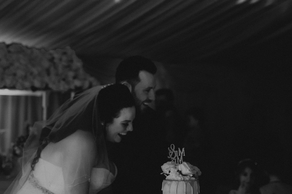 A black and white collage of six photos showing intimate moments at a wedding celebration.