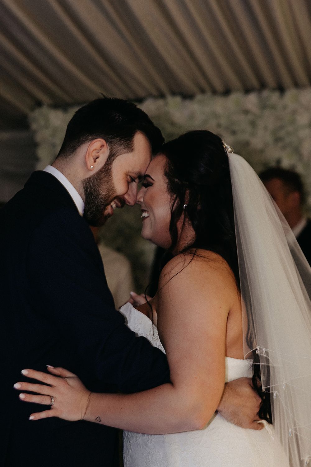 A romantic wedding dance sequence showing tender moments between newlyweds in black and white.