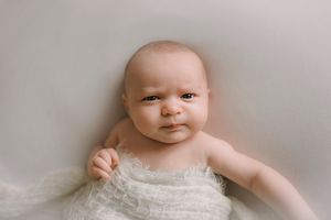 Timeless newborn portrait on white blanket in Springfield Missouri.