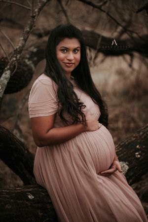 Maternity portrait outdoors at golden hour – Springfield Missouri photographer.