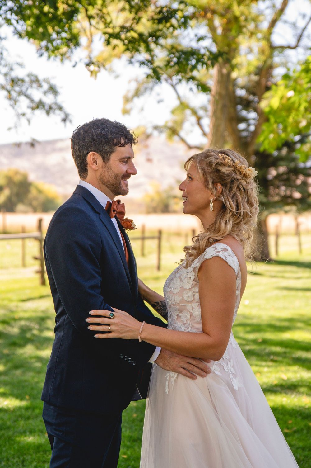 A romantic first look sequence between newlyweds in a sunlit garden setting during their wedding celebration.