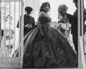 A black and white photo series showing someone in a formal gown inside a church setting.