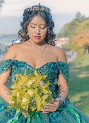 Detailed shots of emerald gown with crystal accessories and yellow orchid bouquet.