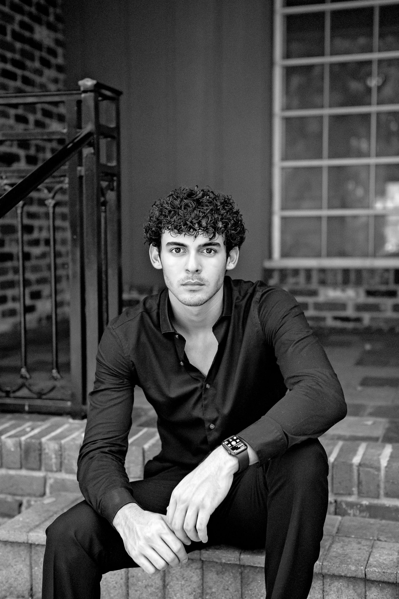 Black and white portrait series of person in dark shirt sitting on brick steps.
Personal branding.
Senior session.