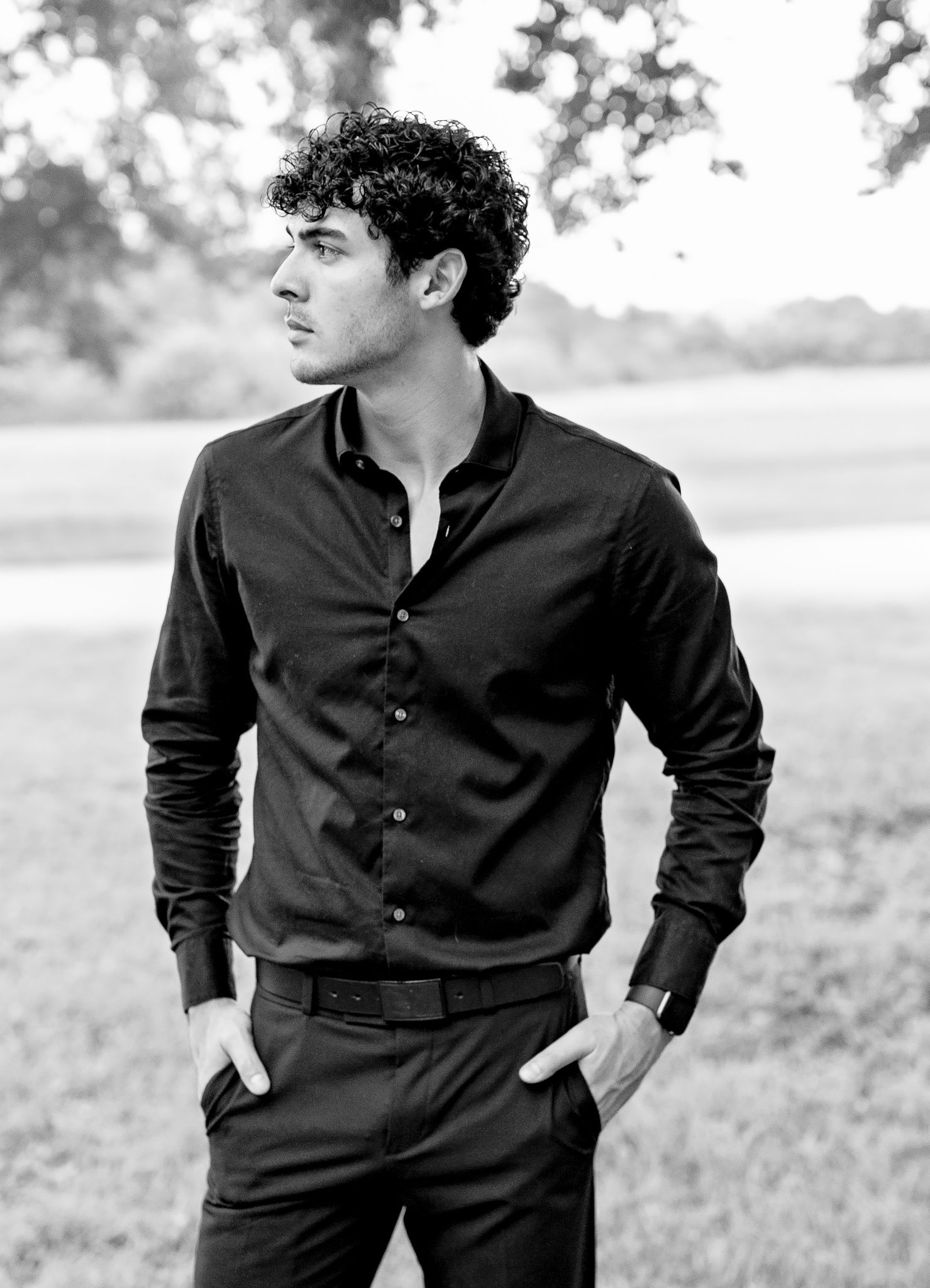 Outdoor black and white portraits in dark button-up shirt against natural background.
Personal branding.
Senior session.