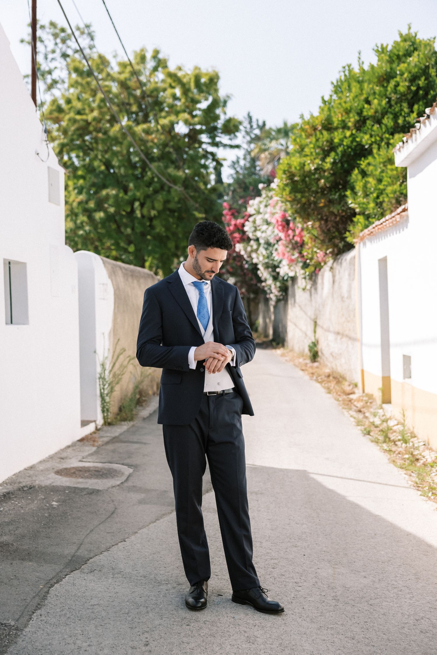 Elegant groom portrait in traditional Portuguese village in Portugal