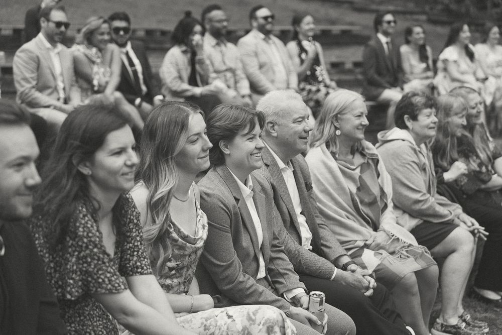 Vintage black and white photo of guests seated at outdoor wedding in Hendersonville, NC - Camp Pinnacle.