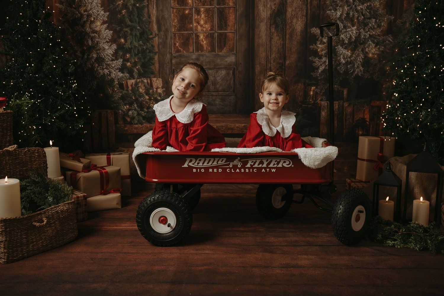 Cozy Christmas scene with a child lying on a rug near wrapped presents and glowing candles in a rustic room.