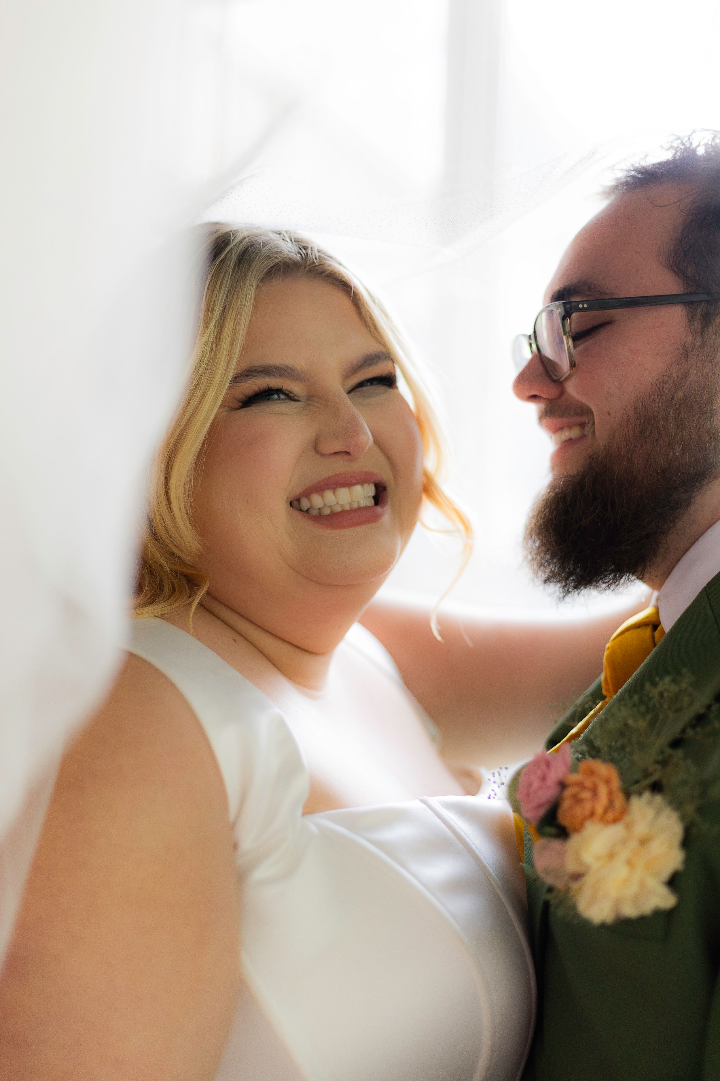 Romantic sunlit wedding portraits capture intimate moments between newlyweds against a bright background.