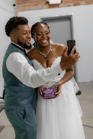 Candid moments of a wedding couple dancing and embracing during their celebration.