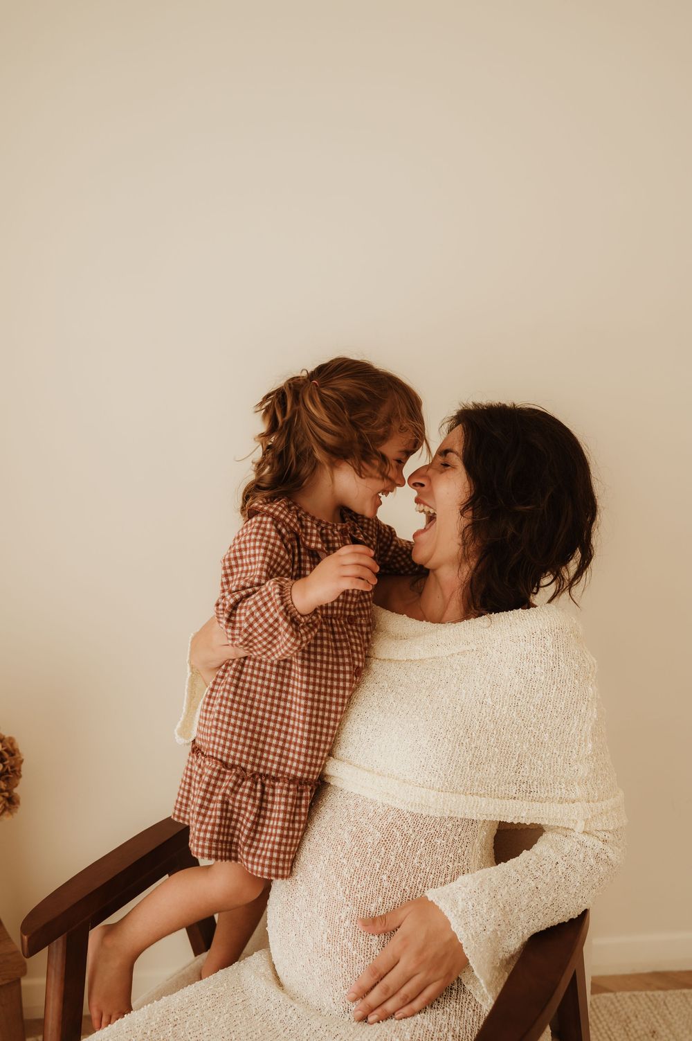 Intimate moment captured in a series of candid photos showing affectionate interaction in a warm, natural setting.