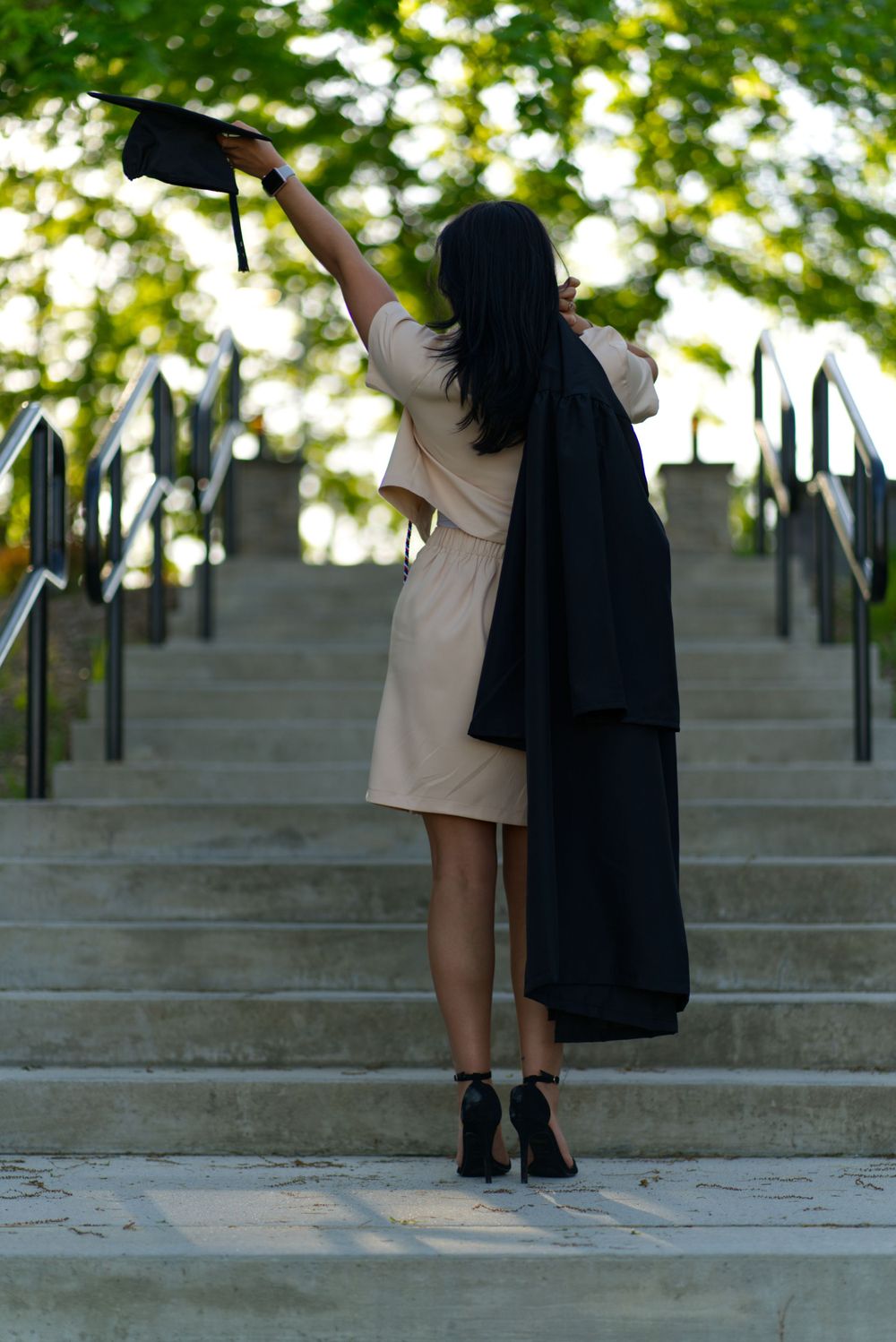 Graduation Photoshoot for new graduate, outdoors on campus