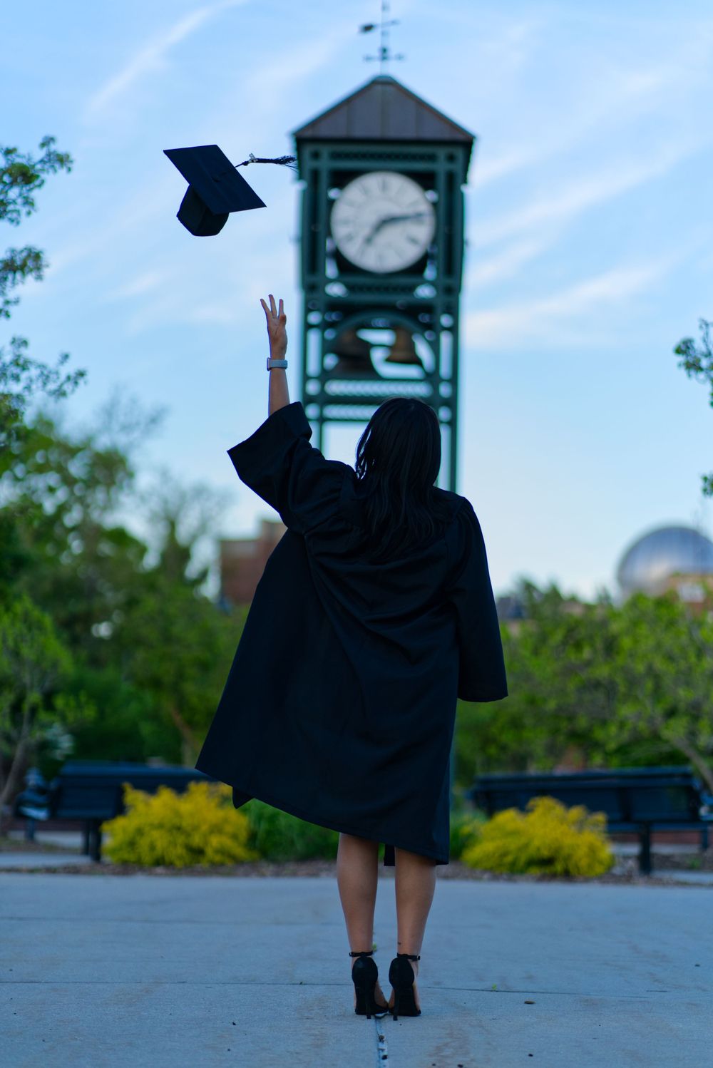 Graduation Photoshoot for new graduate, outdoors on campus