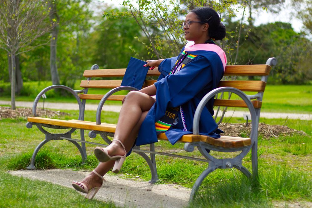 Graduation Photoshoot for new graduate, outdoors on campus