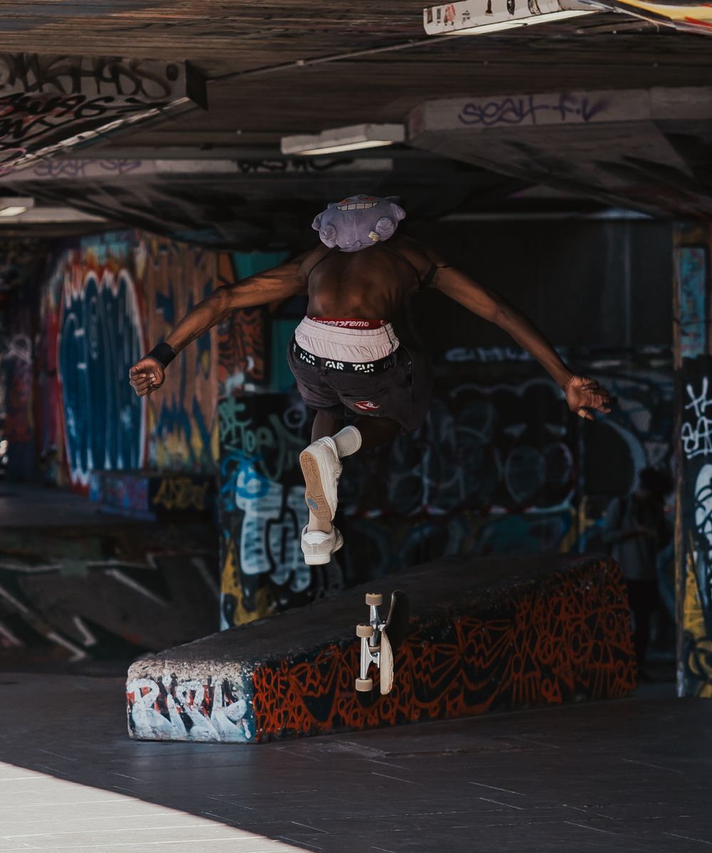 Male skateboarder mid-air at Southbank Skate Park, London capture by Shayla Bloom Photography