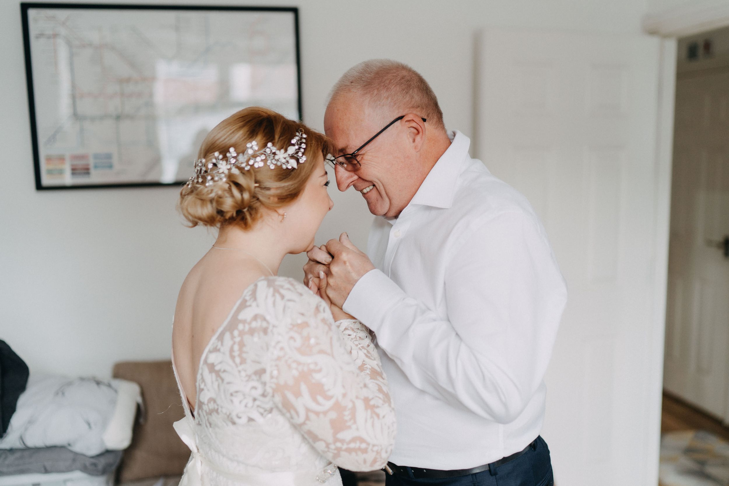 An intimate and emotional embrace captured during a wedding preparation.