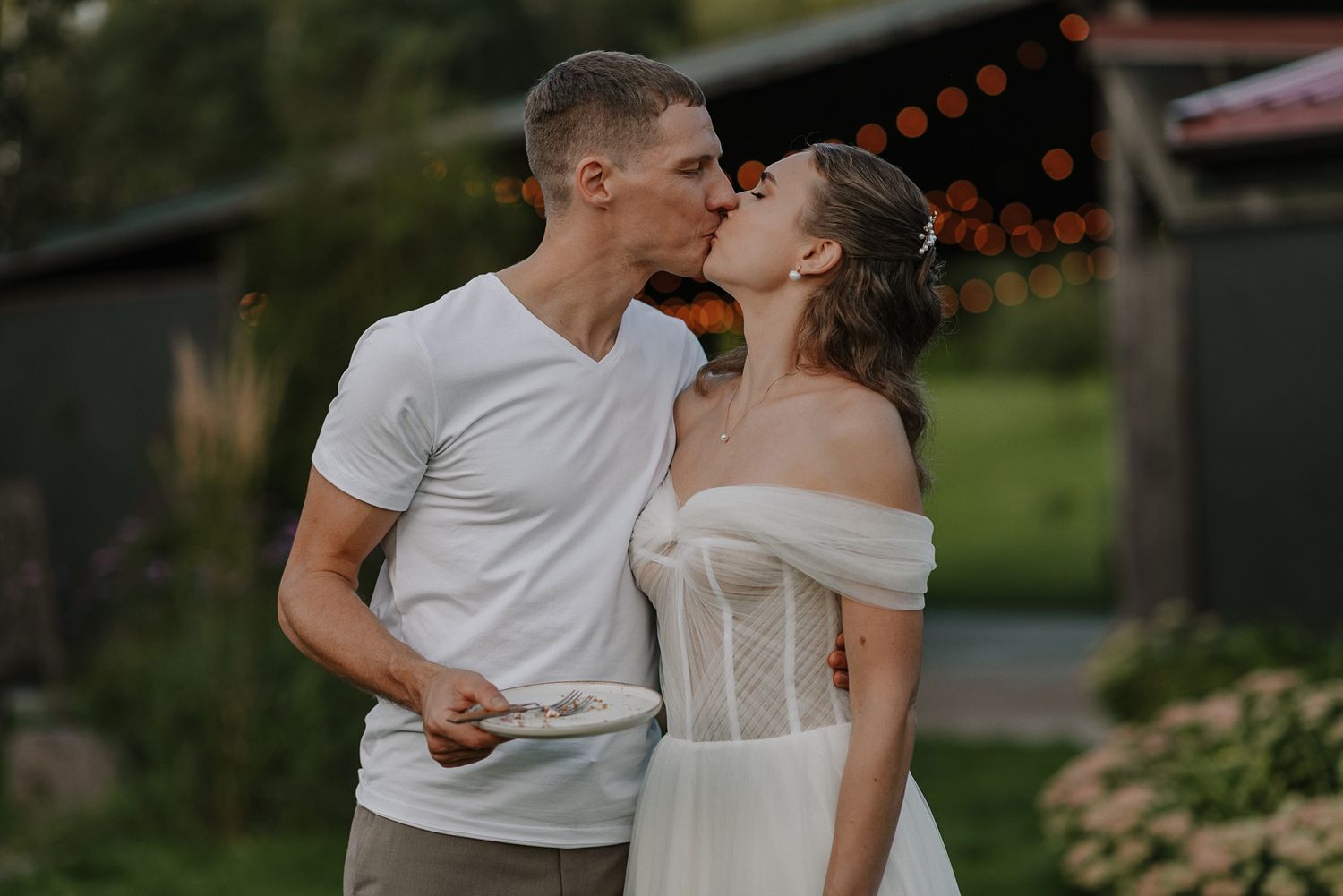 A romantic wedding photo series showing intimate moments between a couple in white and formal attire outdoors.