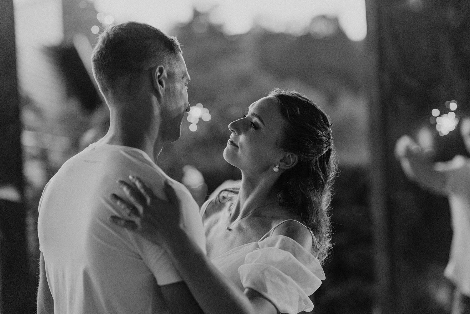 Black and white romantic dance photos showing tender moments between newlyweds.
