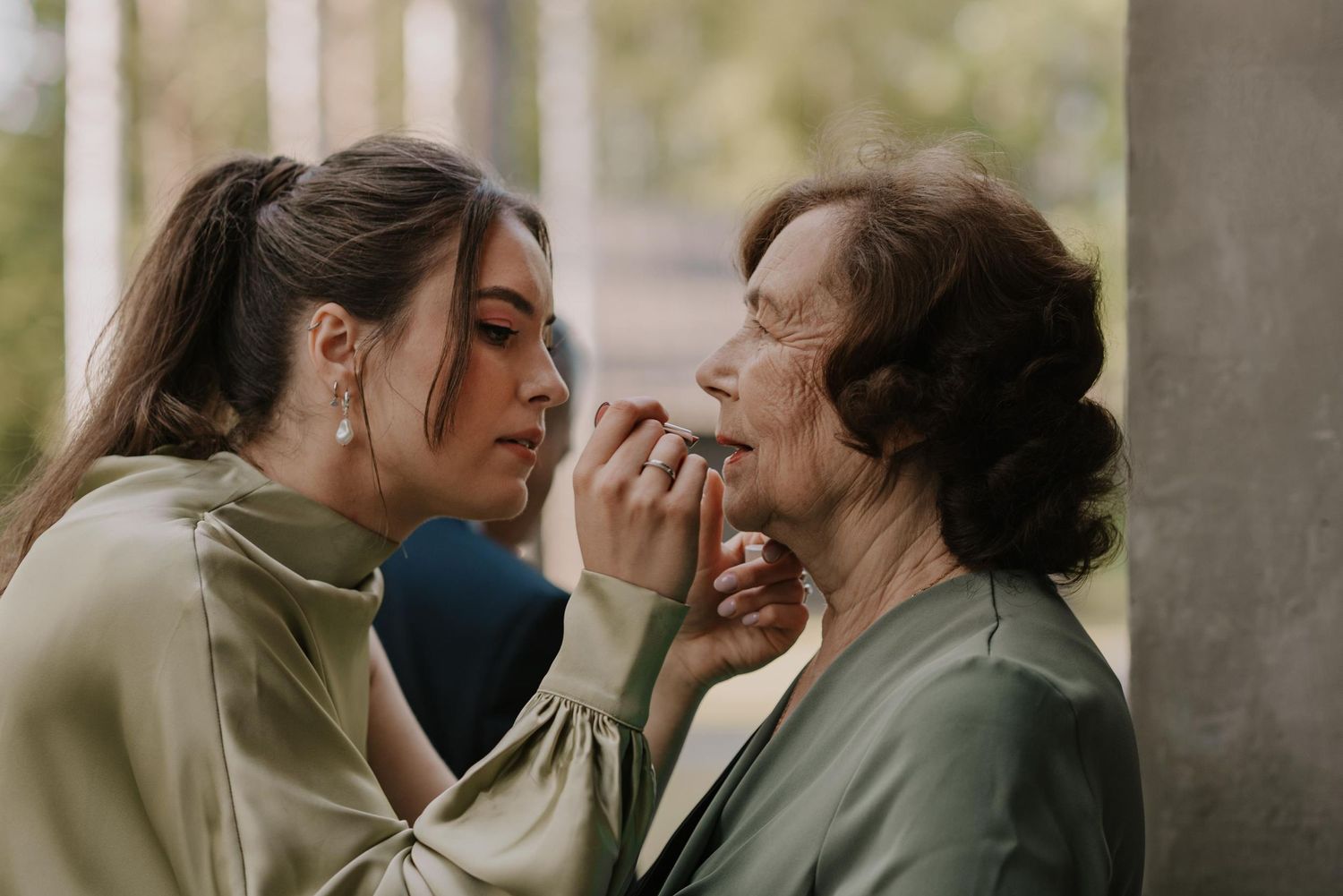 Candid wedding moments captured in soft natural light showing affectionate poses.