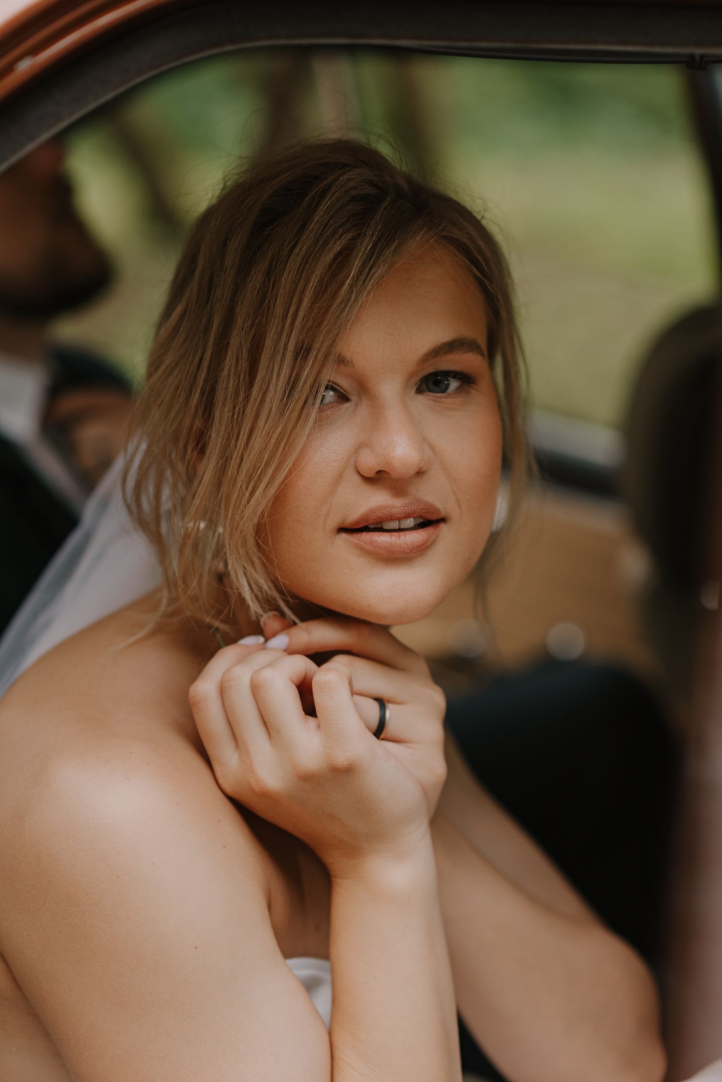 Intimate portrait of a bride showing genuine joy and emotion on her wedding day.
