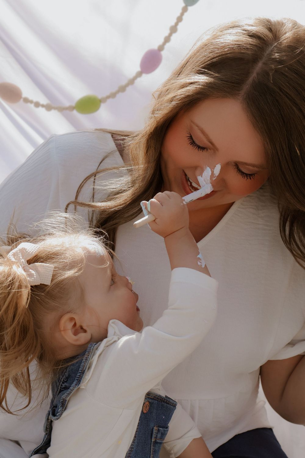 Tender moment captured during outdoor family photography session.