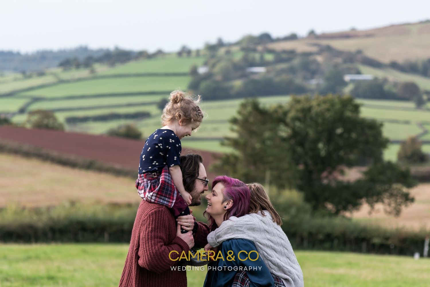 A scenic outdoor photography session in the rolling countryside hills.
