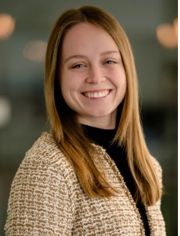 Professional headshot portraits in soft lighting show someone with blonde hair and a warm smile against blurred background.