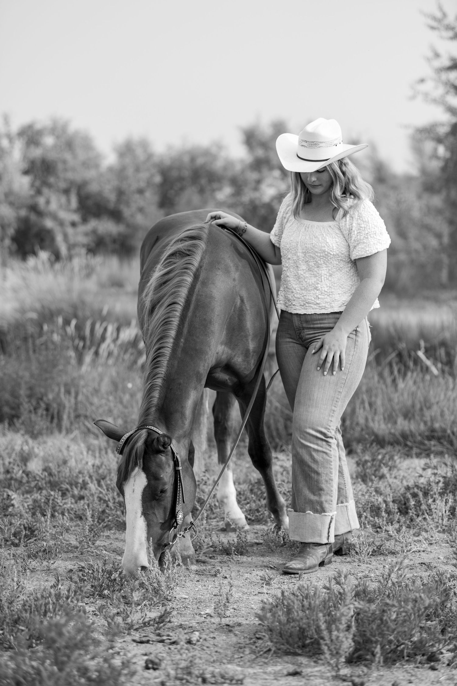 Black and white equestrian portrait of Grace and Boone in Colorado.