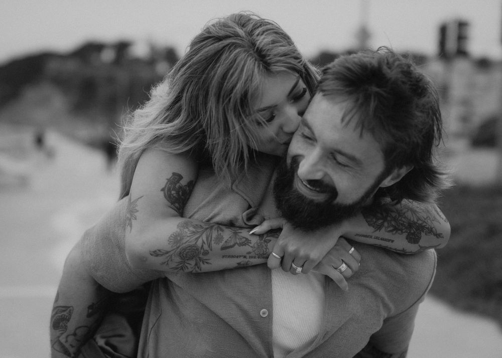 Couple sharing intimate romantic moments together in sequence of black and white photos.