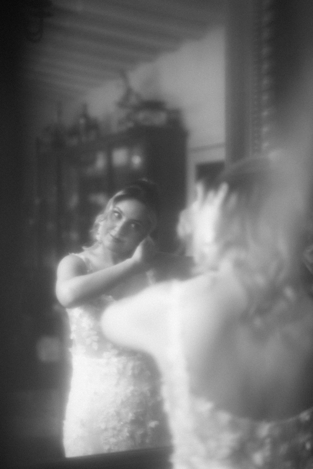 Dreamy black and white wedding portraits with soft focus and ethereal lighting.