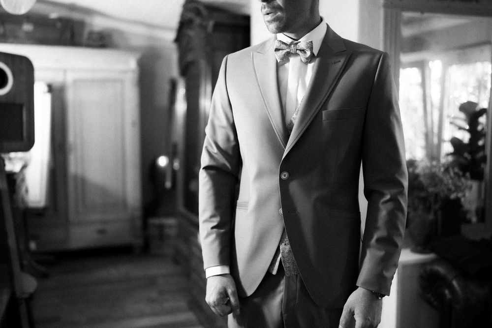 Classic black and white portrait of groomsmen in formal attire.